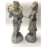 A pair of pretty bisque figures, one as a jester a