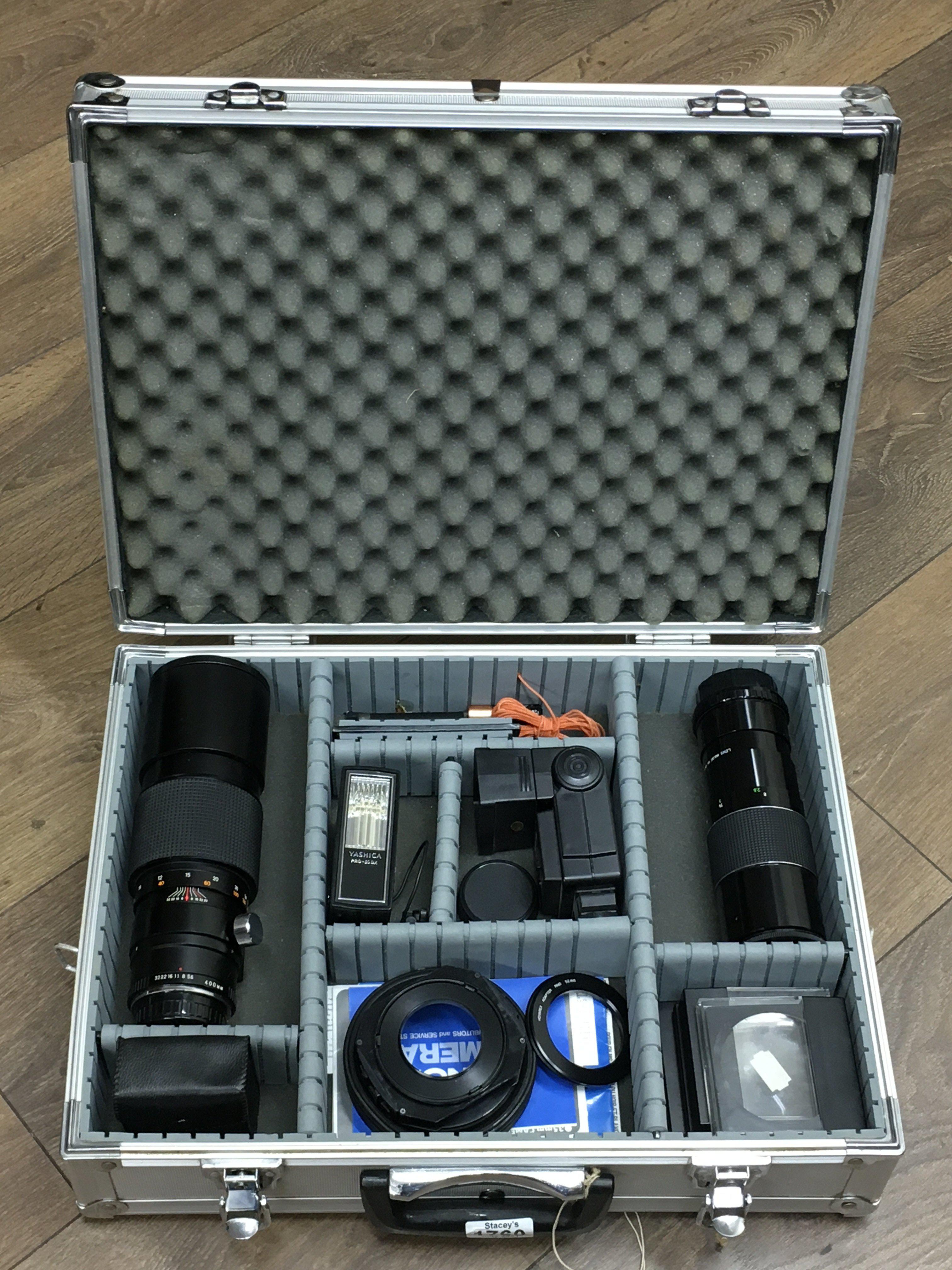A case containing camera equipment including lense
