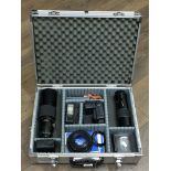 A case containing camera equipment including lense
