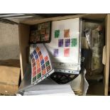 A box of world stamps, British and mixed world stamps.