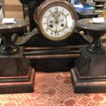 A Victorian slate mantle clock with Roman numerals