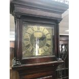 A 18th century oak long case clock the square bras