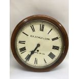 A mahogany wall clock with Roman numerals , R A Jo