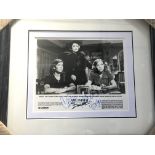 A framed and glazed signed lobby card for 'Appoint