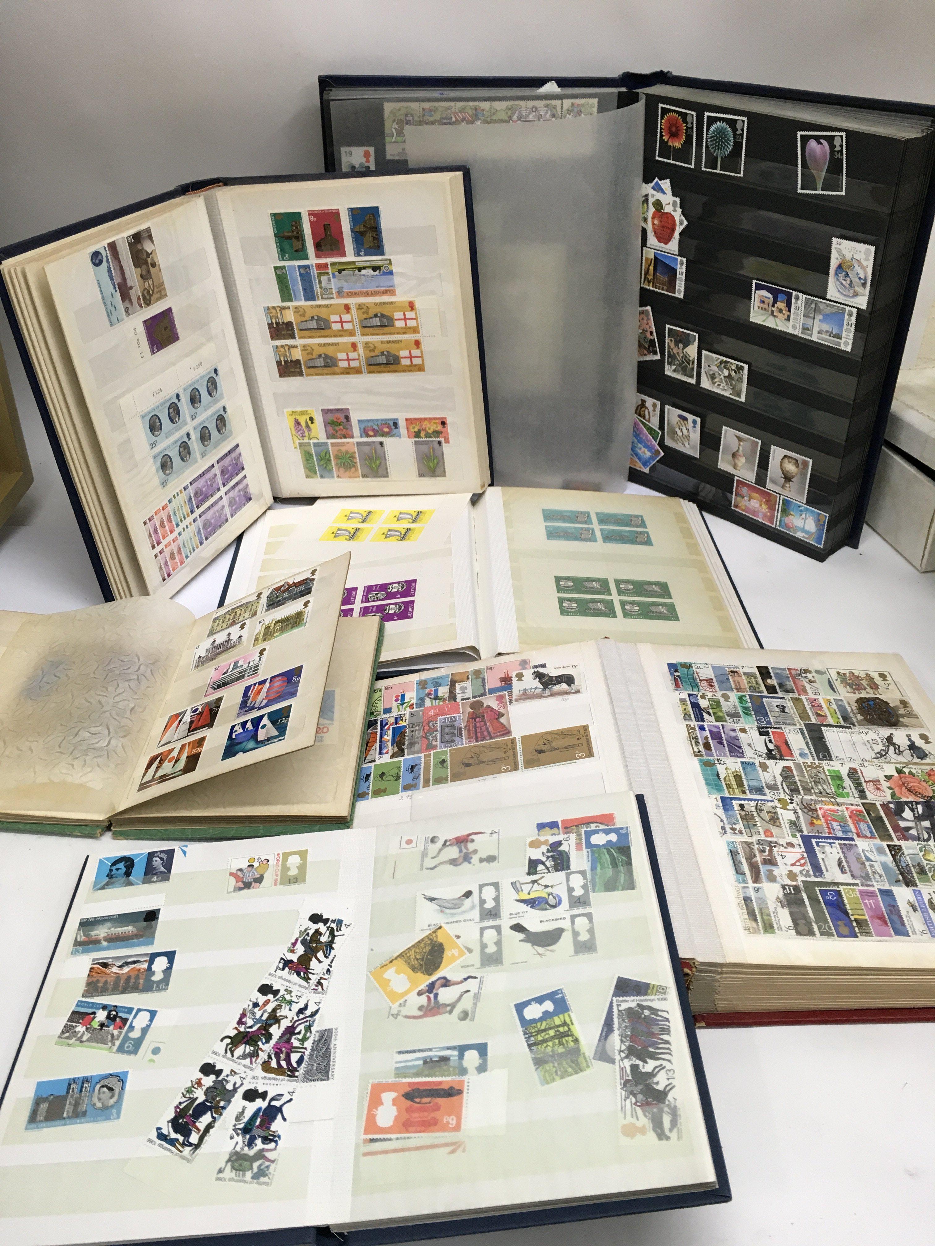 A collection of stamp albums and presentation pack