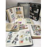 A collection of stamp albums and presentation pack