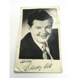 A signed photo of Benny Hill, approx 9cm x 14cm -