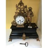 A Victorian slate mantel clock with a gilt case an