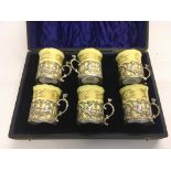 A cased set of silver mounted Royal Worcester cups