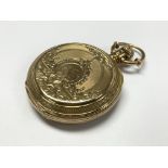 An 18ct gold cased Elgin pocket watch with ornately engraved outer case