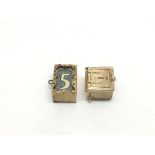 Two 9ct gold charms in the form of British bank no