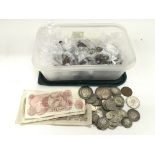 A collection of mixed GB and foreign coinage and bank notes.