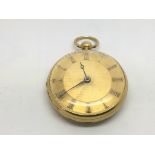 An 18ct gold open face pocket watch with Roman num