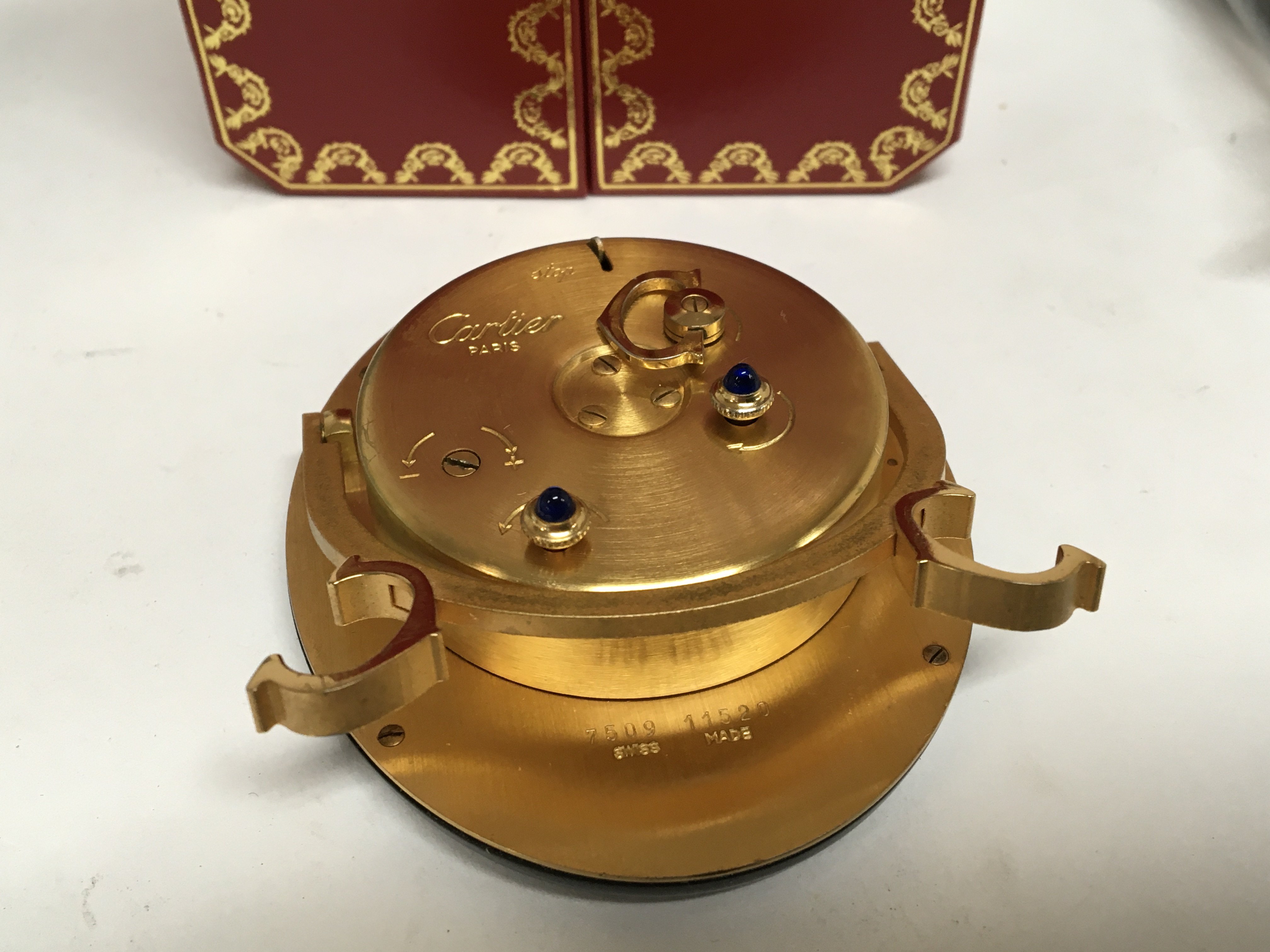 A Cartier traveling alarm clock on an Easel gilt metal stand oval dial manual wind seen working - Image 2 of 3