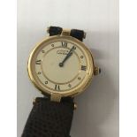 A Cartier silver gilt Must De wristwatch with circular Cream dial and sapphire cabochon set to