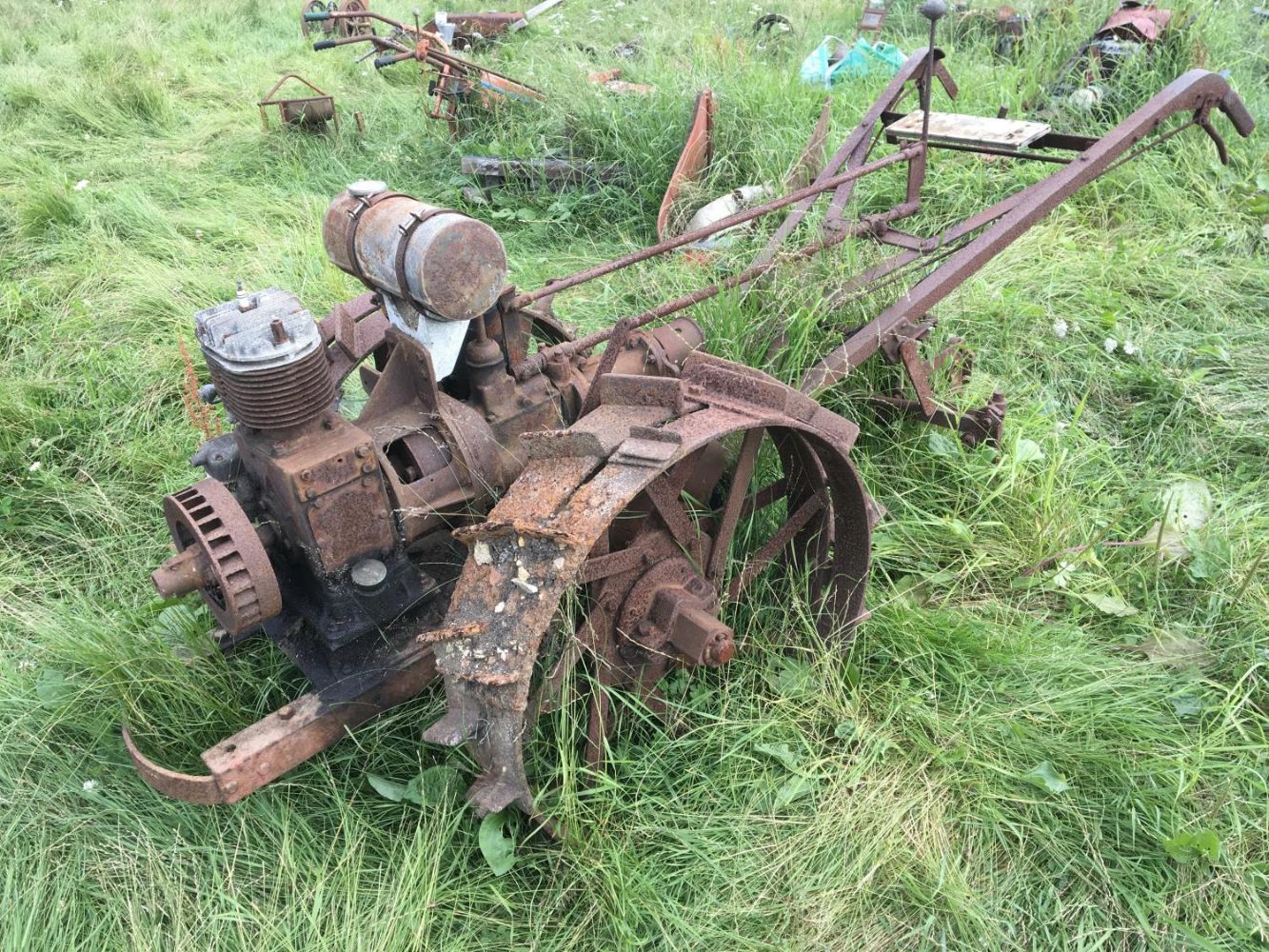 Vintage cycles and small agricultural tractors for restoration