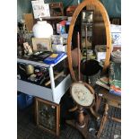 An embroidery stand and oval mirror