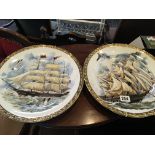 A pair of ceramic wall plates. decorated with sailing ships no damage.