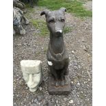 A greyhound dog statue and face