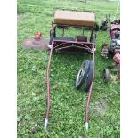 A pony cart with additional wheels To fit up to 13hh approximately
