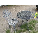 A vintage garden round table and chair
