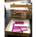 A good condition cased sewing machine maker New Home Super Automatic.