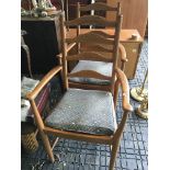 A Pair of Ercol elm ladder back open arm chairs. nice condition. (2)