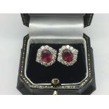 A pair of 18ct white gold ear studs set with treat