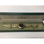 A boxed gents gold plated Gucci watch.