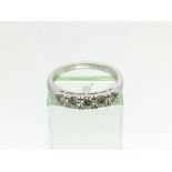 An 18ct white gold five stone diamond ring. RBC di