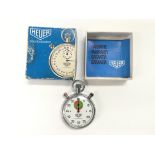 A boxed Tag Heuer trackmaster stopwatch.