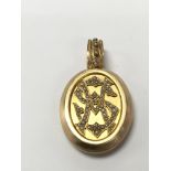 A quality 15 carat gold locket set with seed pearl