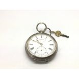 A silver cased pocket watch with key by H.E. Peck