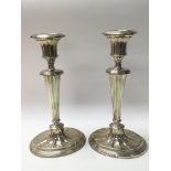 A pair of silver candlesticks, weighing approximat