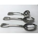 A pair of large silver serving spoons and a silver