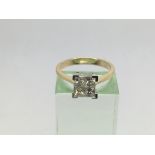 An 18ct yellow and white gold diamond ring set wit