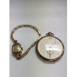 A 15 ct gold ladies watch with plated strap and a