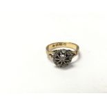 A 22ct gold ring set with a round good pattern of
