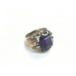 A gents gold ring set with an amethyst, approx 9.2