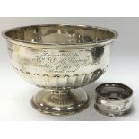 A silver bowl and a singular silver napkin ring. W