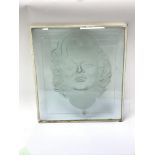 An Art Deco etched glass plaque