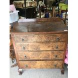 A walnut veneered four draw chest with brass drop