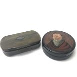 An antique horn snuff box with a cartouche on the