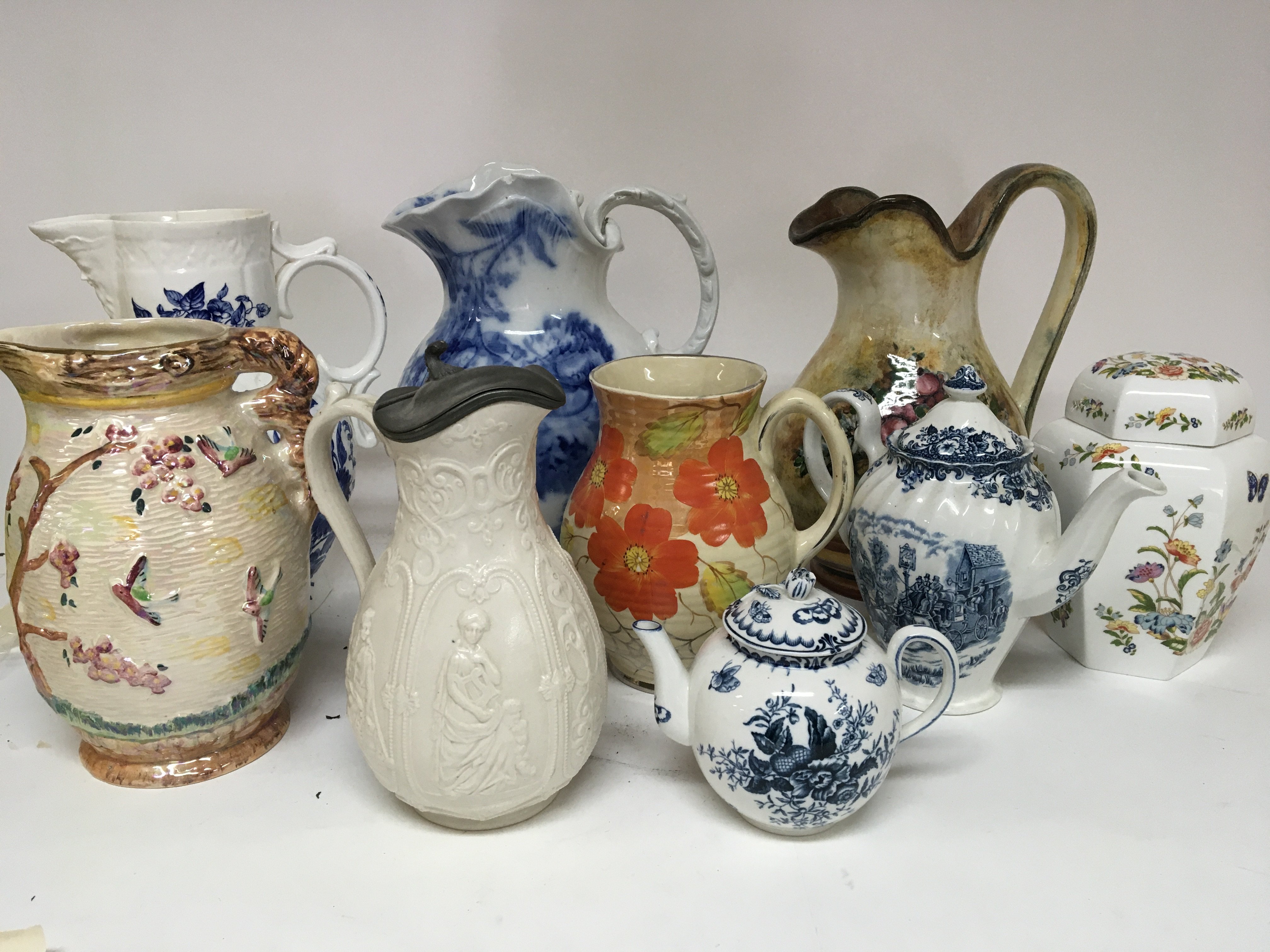 A collection of large jugs and a Worcester style t