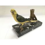 A cold painted bronze table lighter in the form of