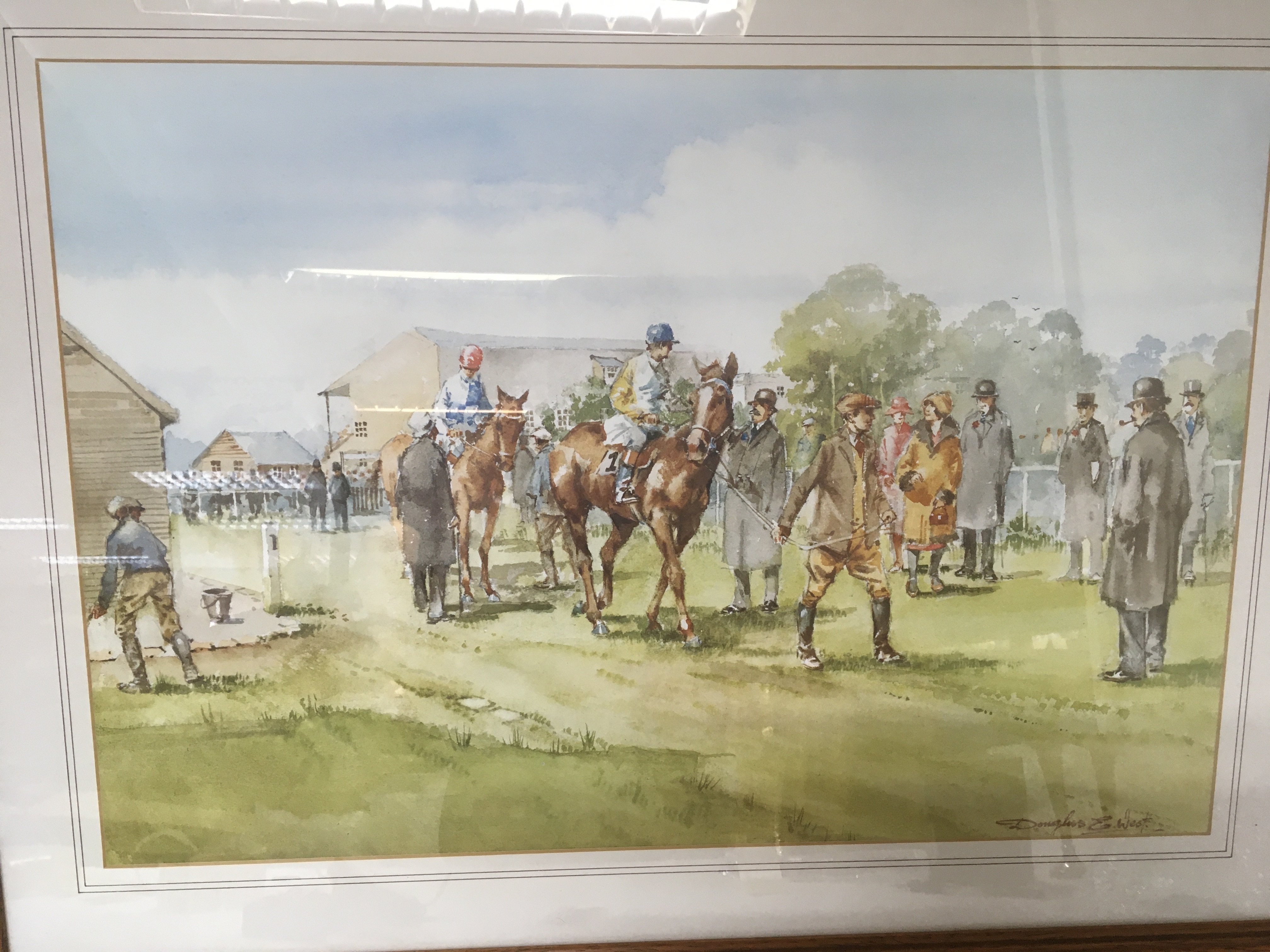 A framed horse racing print after the original by