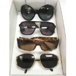 Four pairs of designer sunglasses comprising D&G,