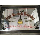 A framed Bells old scotch whiskey advertising mirr