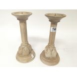 A pair of modern design limed oak candle sticks by