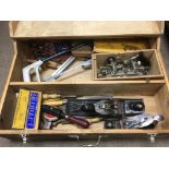 A carpenter's box containing various tools includi